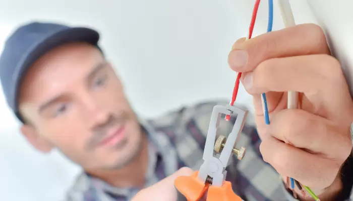 Electrician snipping a wire